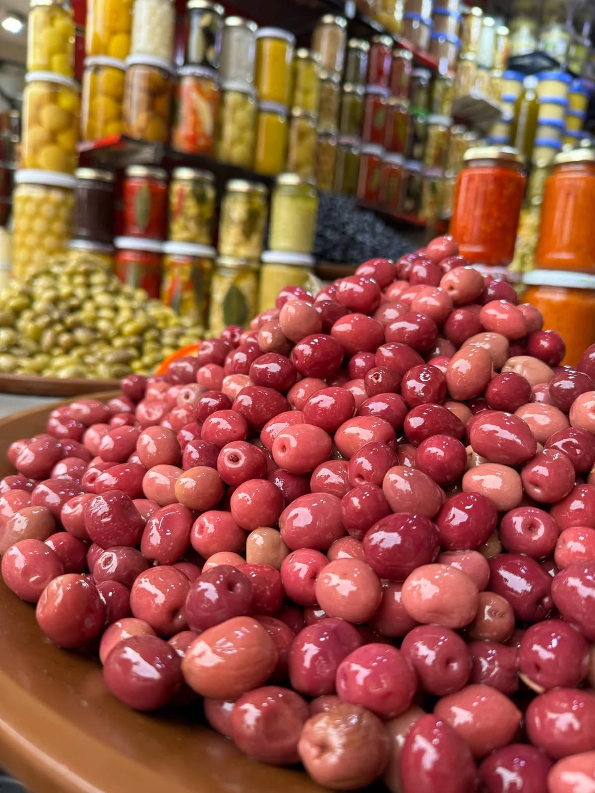 Olives and market displays inside the Marrakech medina